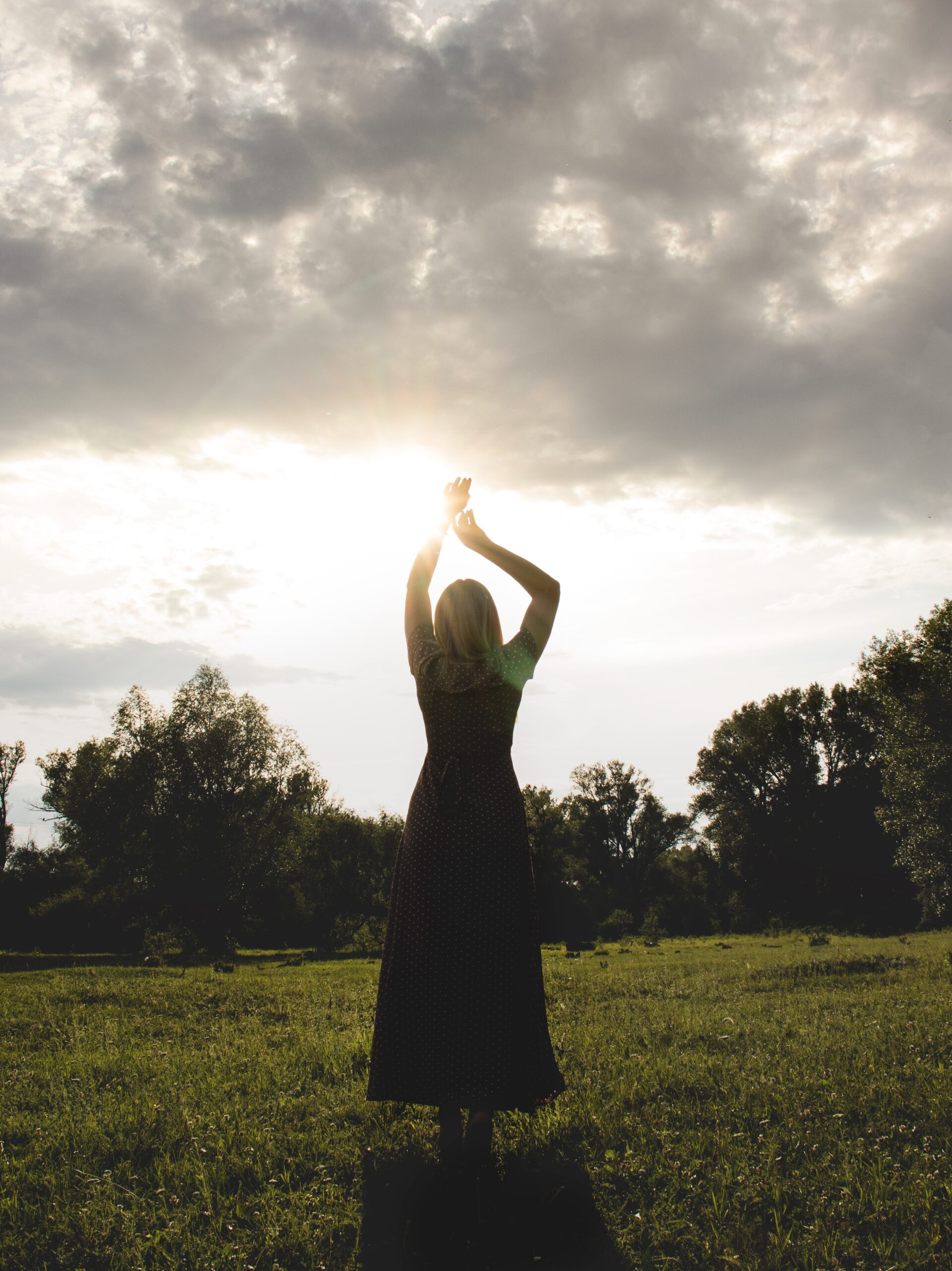 silhouette-of-a-woman-in-a-dress-against-the-sunse-2025-01-10-12-40-26-utc